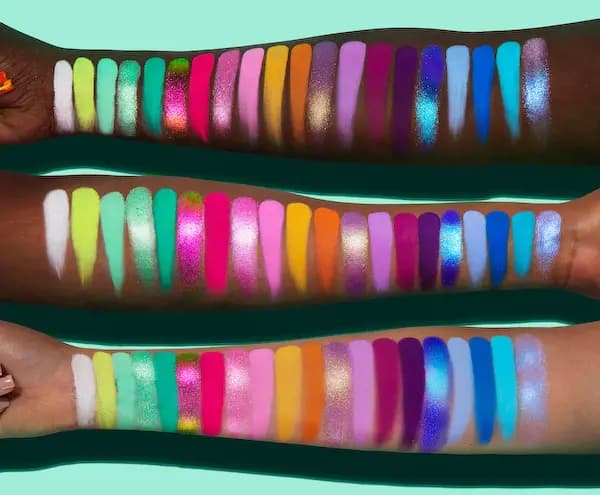 Arm swatches of all 20 Cosmic Brushes Delights Palette shades on deep, medium and light skin tones