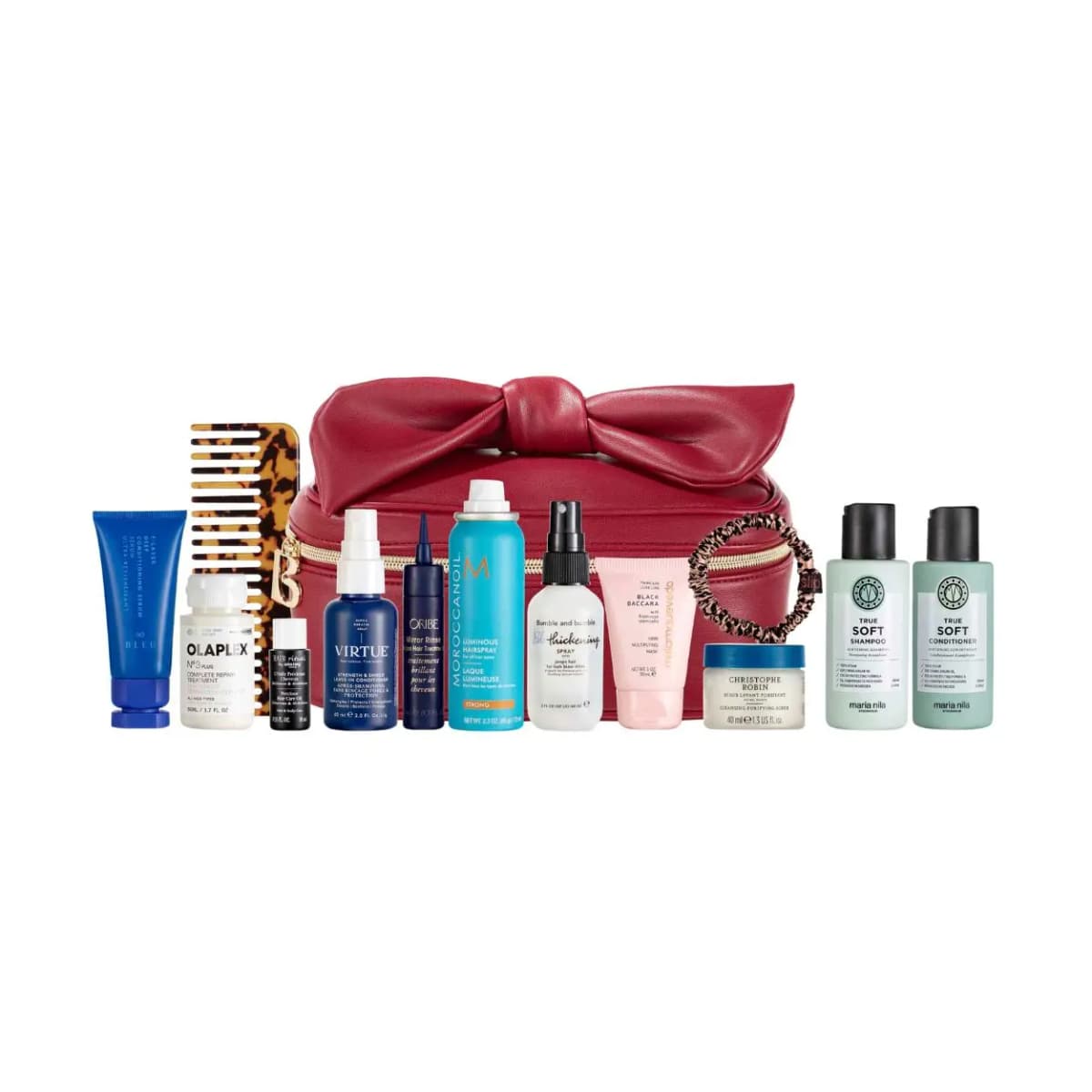 Red bow beauty case lined up behind the full row of travel-size hair products, comb and scrunchie on white