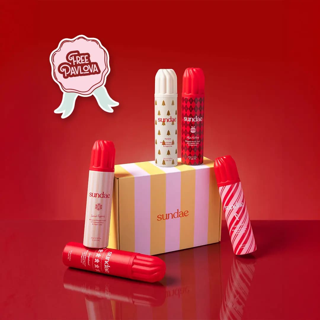 Pavlova, Plum Pudding, Spiced Eggnog, Gingerbread and Candy Cane cans around a striped box with Free Pavlova badge