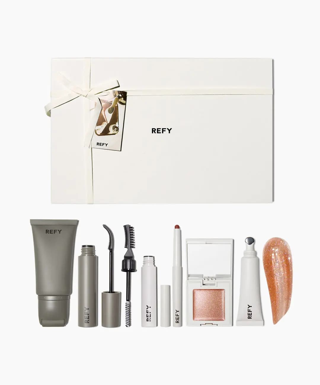 REFY Shimmer Sculpt Full Collection gift set: cream box with ribbon above primer, mascara, brow gel, liner, shimmer, gloss