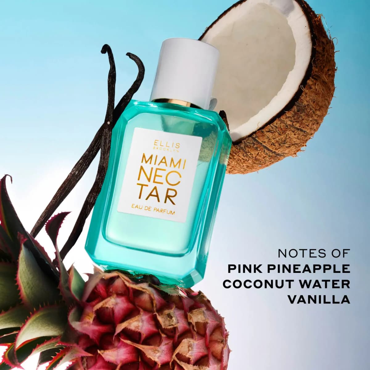 Aqua MIAMI NECTAR bottle with pink pineapple, vanilla pods and halved coconut on blue sky, listing pineapple, coconut