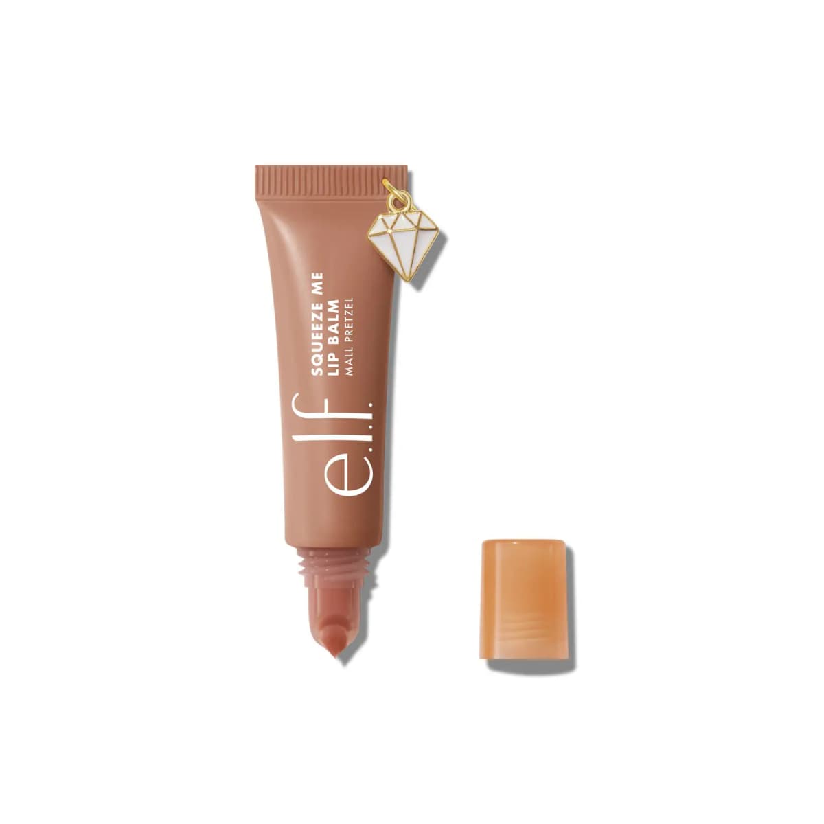 Brown Mall Pretzel tube with white diamond charm, uncapped to reveal a nude-pink balm tip, orange cap beside
