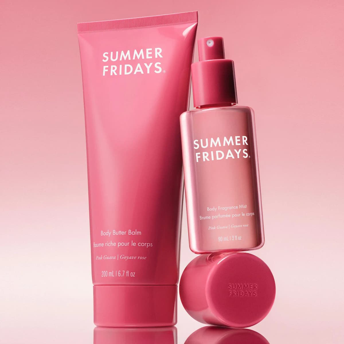 Hot pink Pink Guava Body Butter Balm and Body Fragrance Mist, the mist balanced on its embossed cap on a pink backdrop.