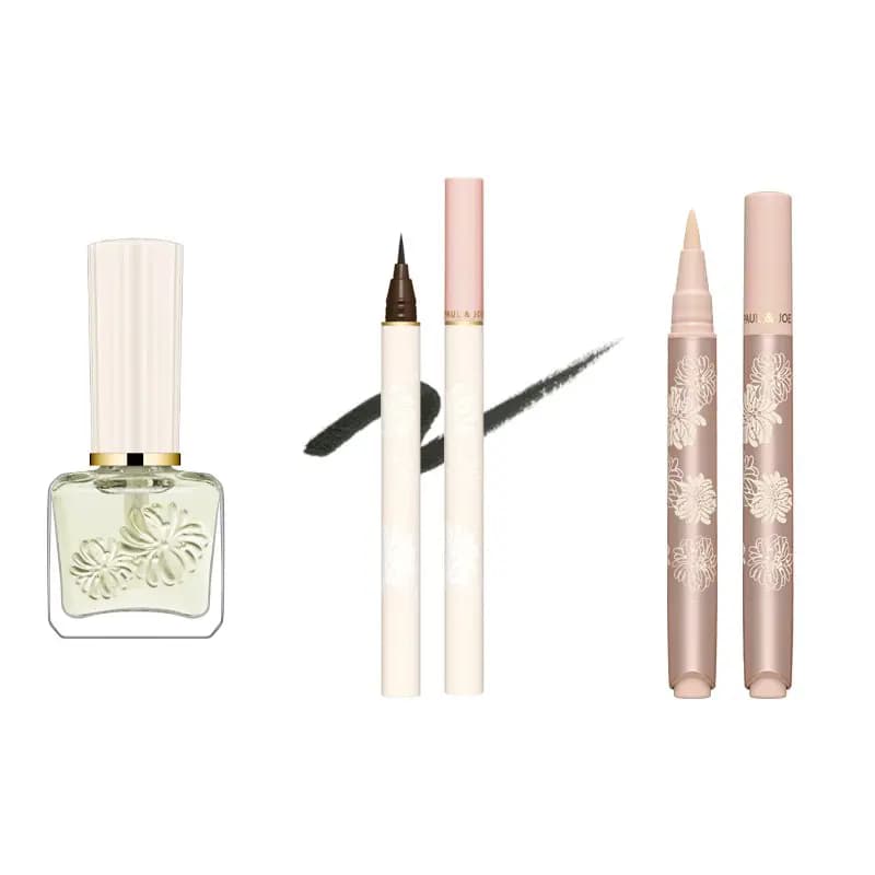 Pale green nail polish, a white liquid eyeliner with dark stroke swatch and a rose-gold floral concealer pen