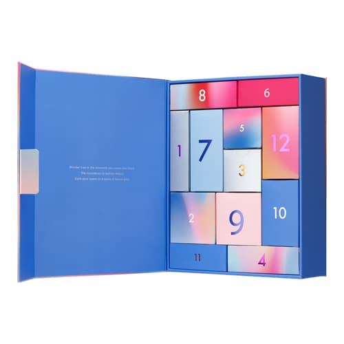 Open advent calendar interior revealing numbered blue and pink boxes arranged in a grid