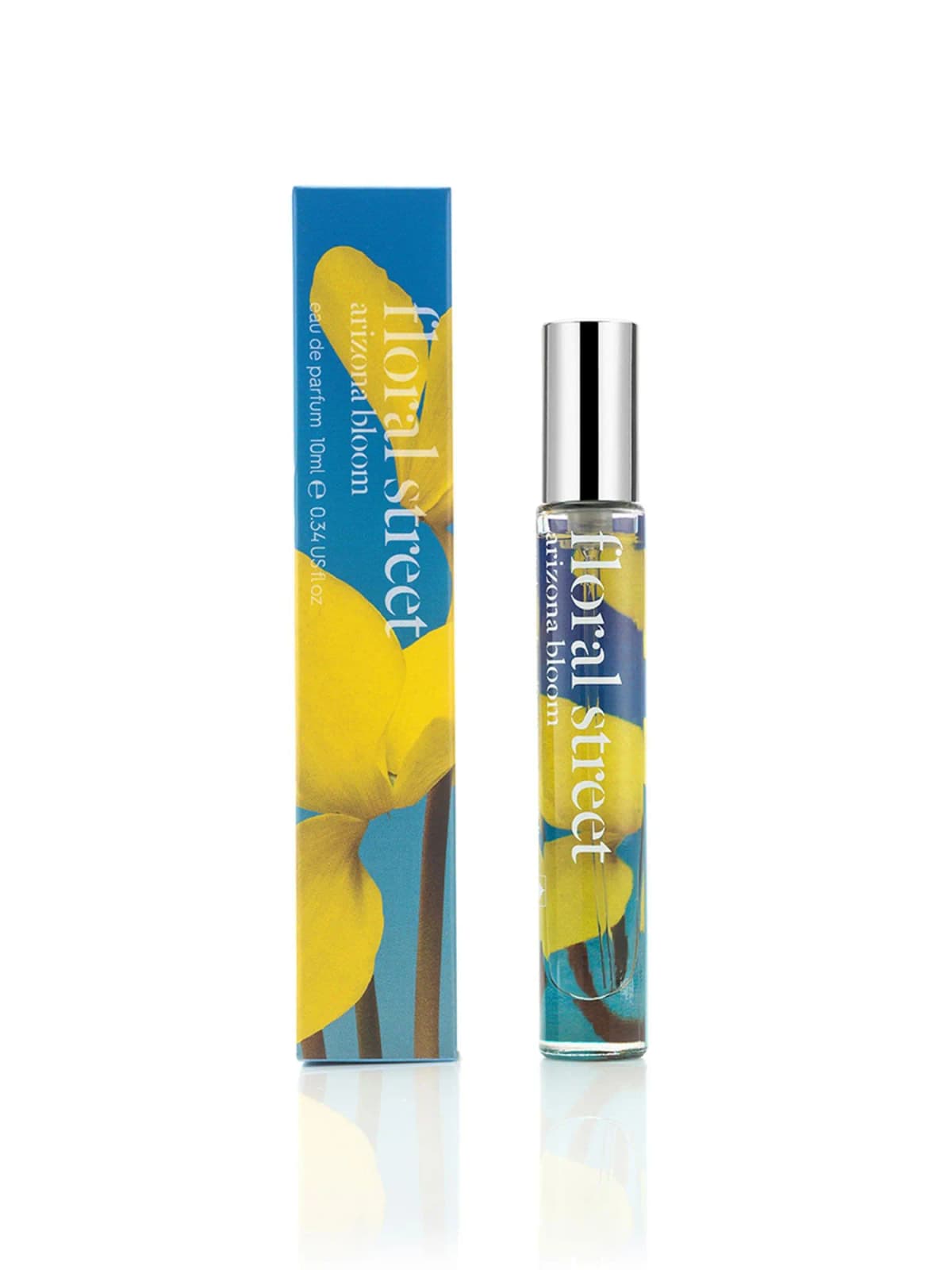 Floral Street Arizona Bloom 10ml travel spray printed with yellow flowers on blue, beside its matching box.