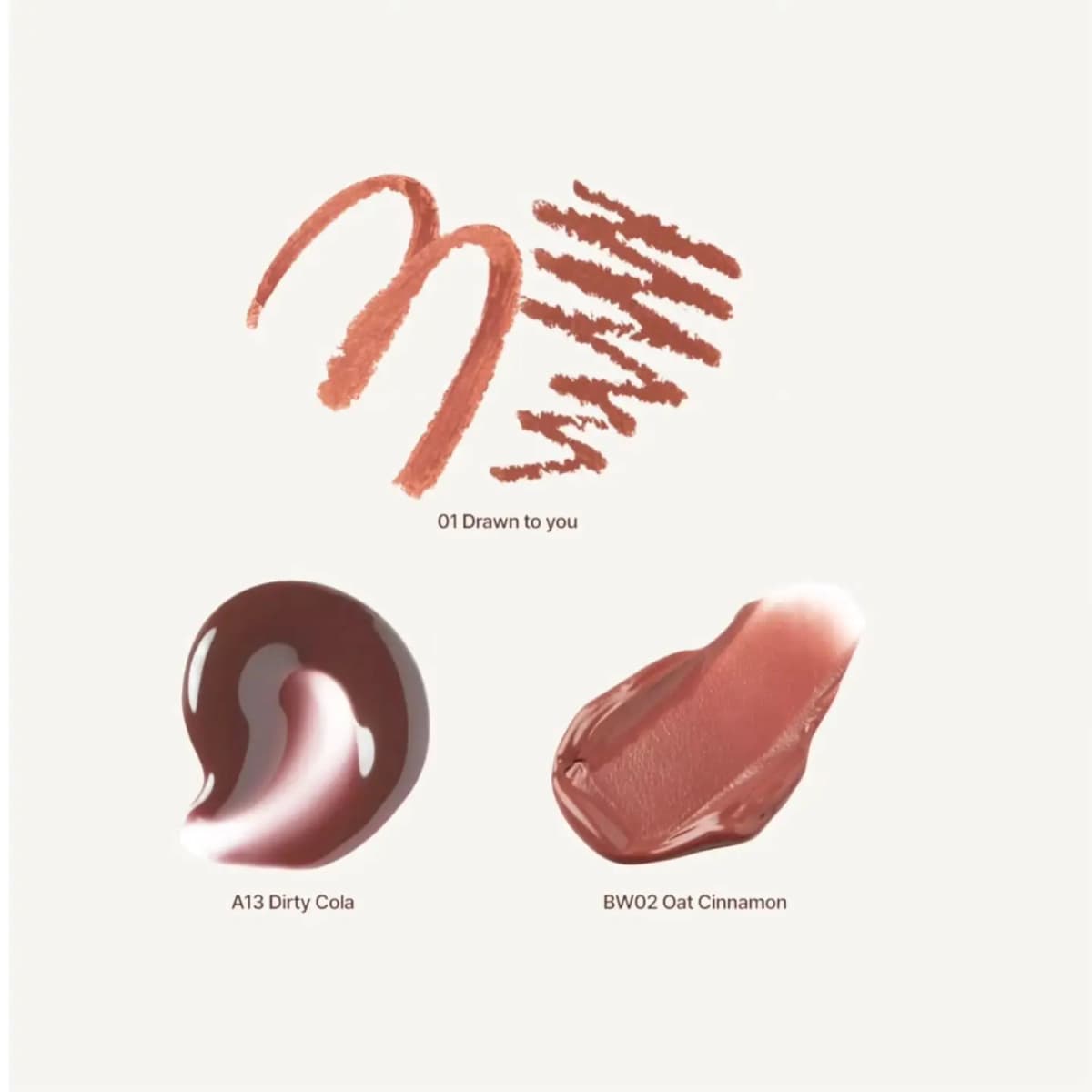 Swatches of 01 Drawn to you liner, glossy A13 Dirty Cola gloss and creamy BW02 Oat Cinnamon balm on off-white.