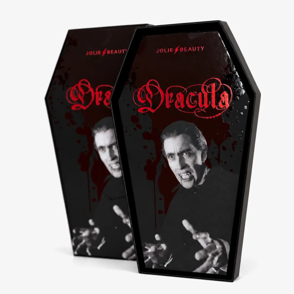 Two coffin-shaped Jolie Beauty Dracula palette boxes with blood-splatter print and vampire artwork on white