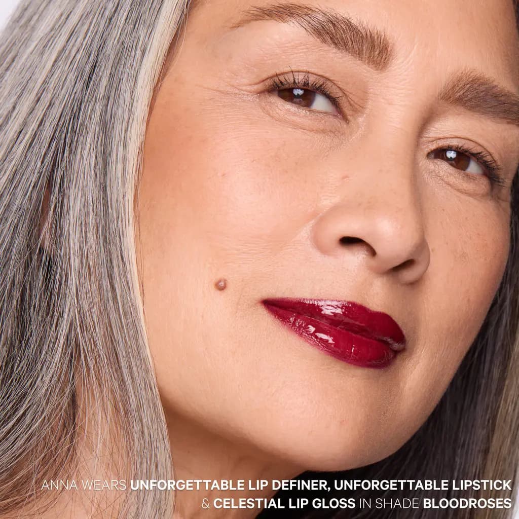 Silver-haired model with glossy deep burgundy lips wearing lip definer, lipstick and gloss in Bloodroses