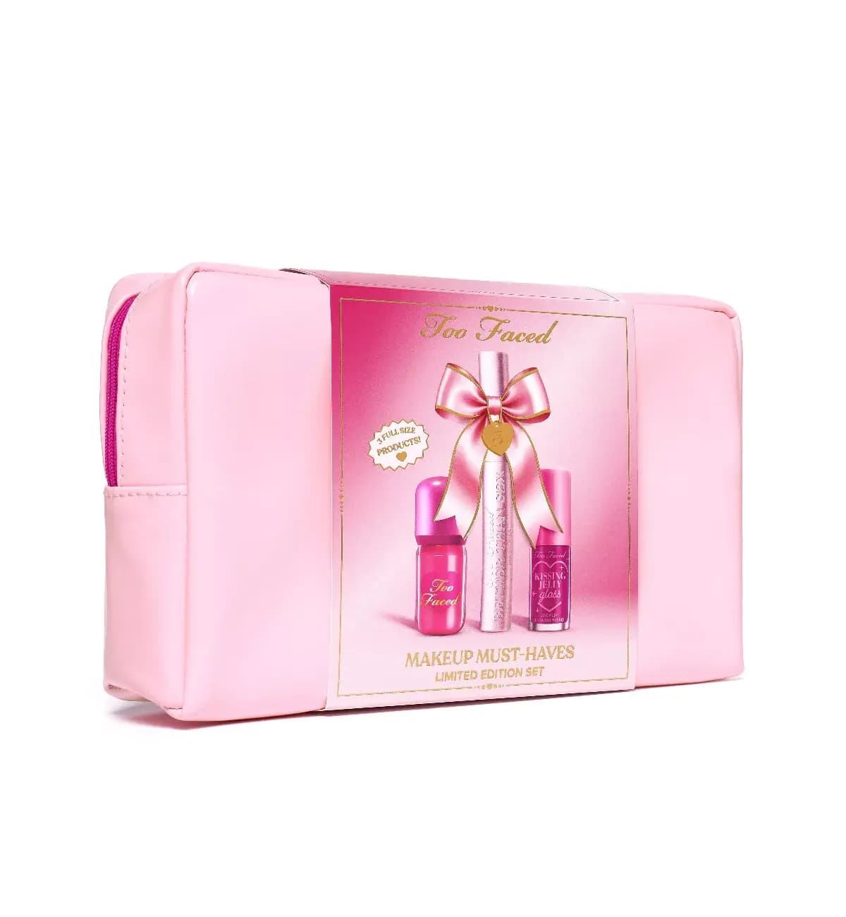 Pink patent makeup bag wrapped in a sleeve reading Makeup Must-Haves Limited Edition Set, 3 full size products