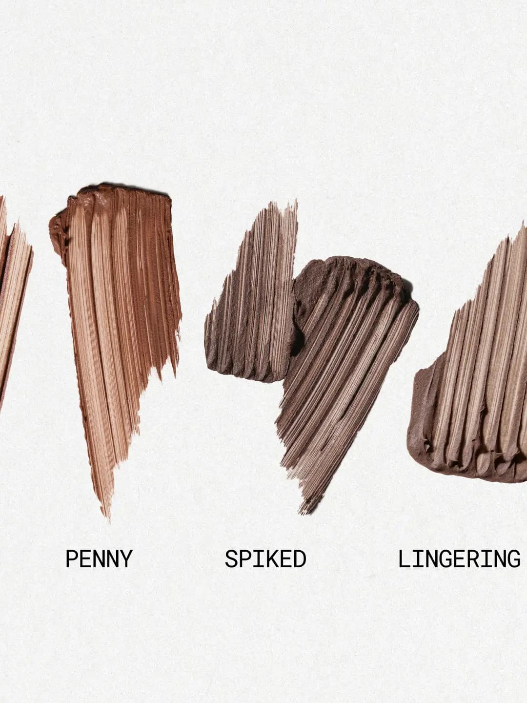 Three brow mousse swatches labeled Penny, Spiked and Lingering in copper, cool brown and dark brown