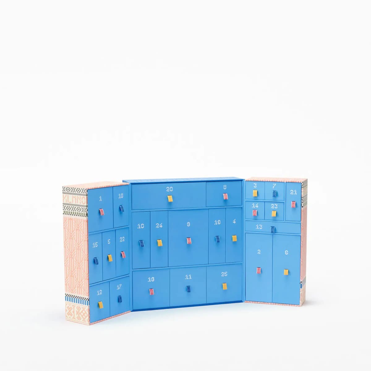 Opened calendar revealing bright blue interior with numbered drawers and colourful ribbon pulls