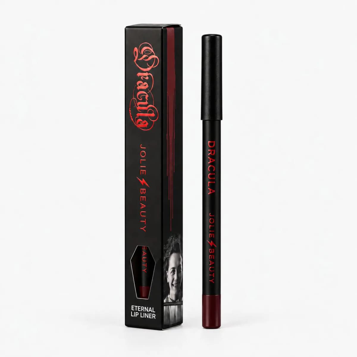Dracula Eternal Lip Liner in deep burgundy beside its black box with a coffin-shaped window