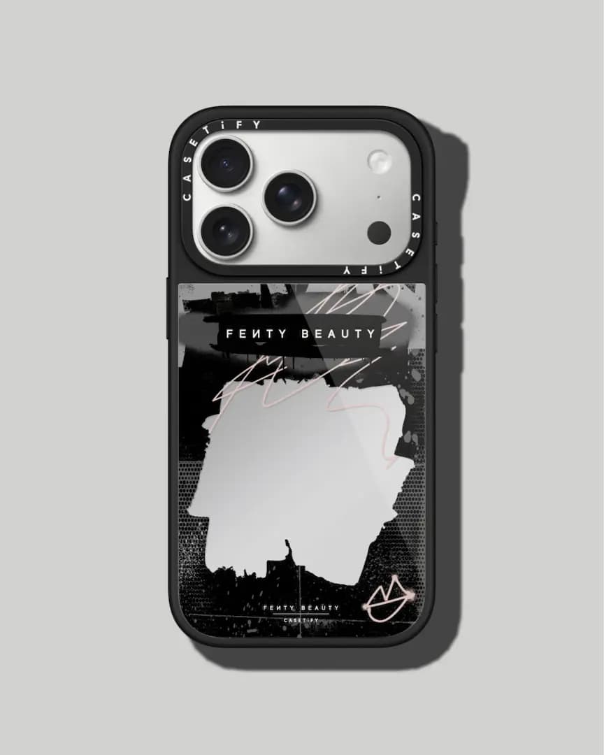 Black mirror iPhone case with a "Fenty Beauty" label, pink scribbles and a halftone graffiti backdrop