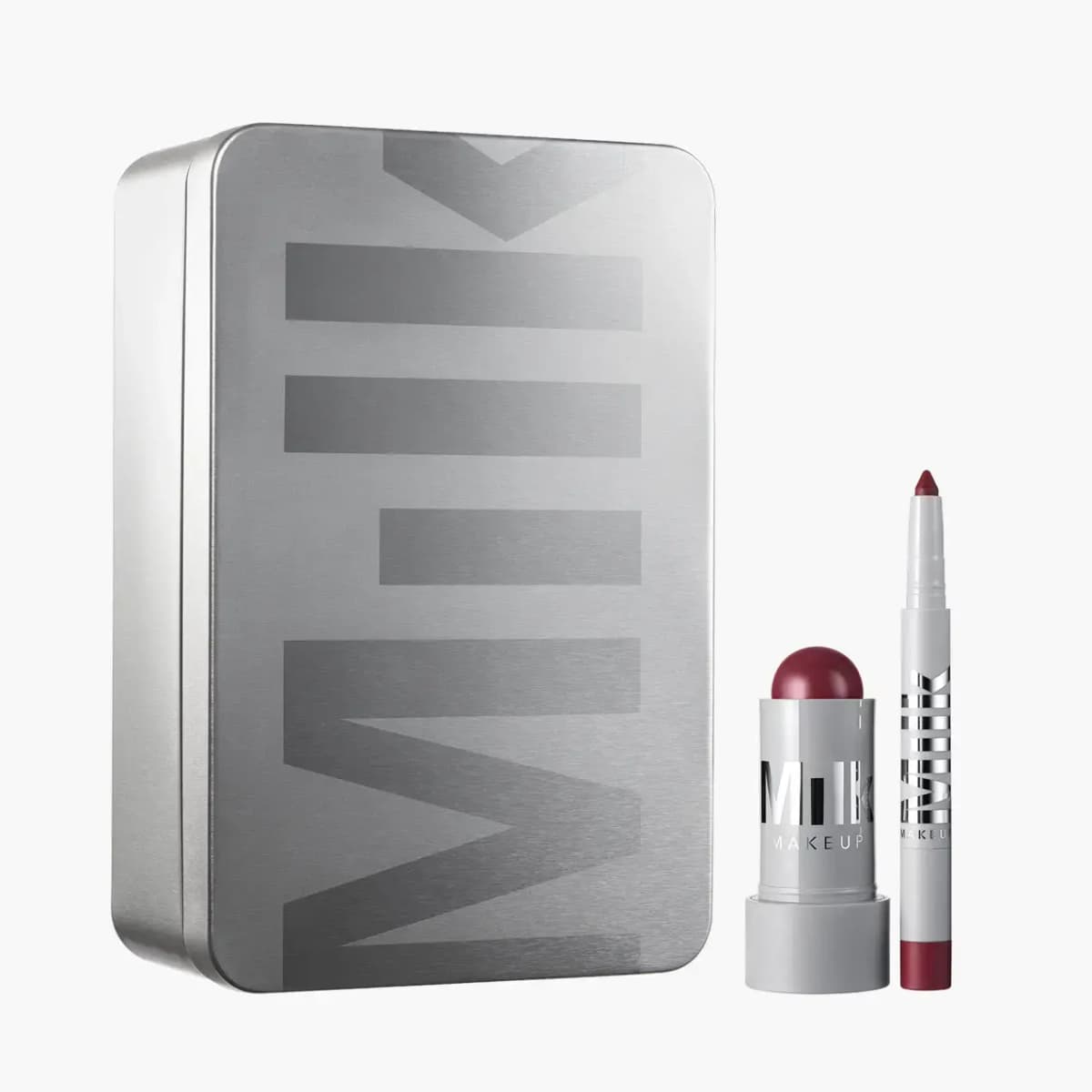 Last Call Lips: tall silver Milk tin with a burgundy Lip + Cheek stick and matching lip pencil