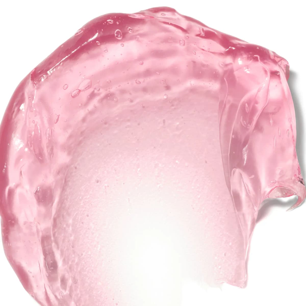 Close-up swatch of translucent pink gel moisturizer spread thin, fading to sheer at the centre
