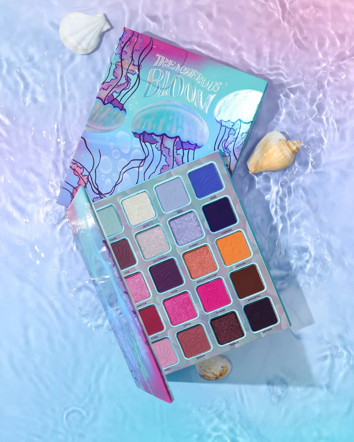 Treacherous Bloom palette and its jellyfish box floating on rippling water with scattered seashells