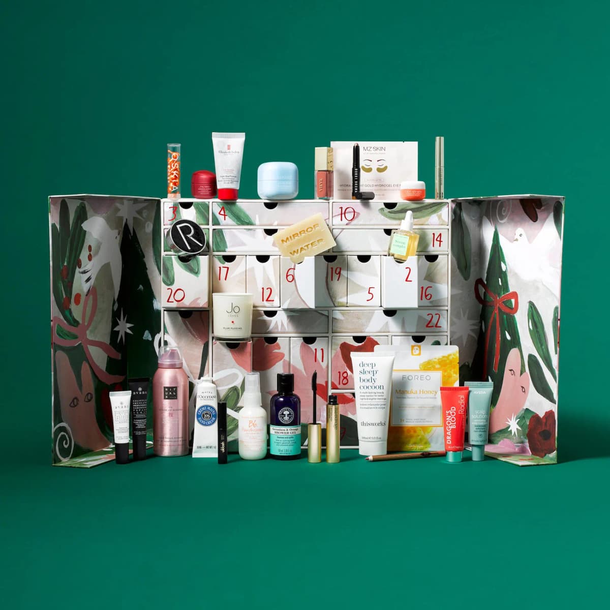 Calendar opened to reveal numbered drawers with products like Laneige, Jo Loves candle and Foreo mask displayed around it