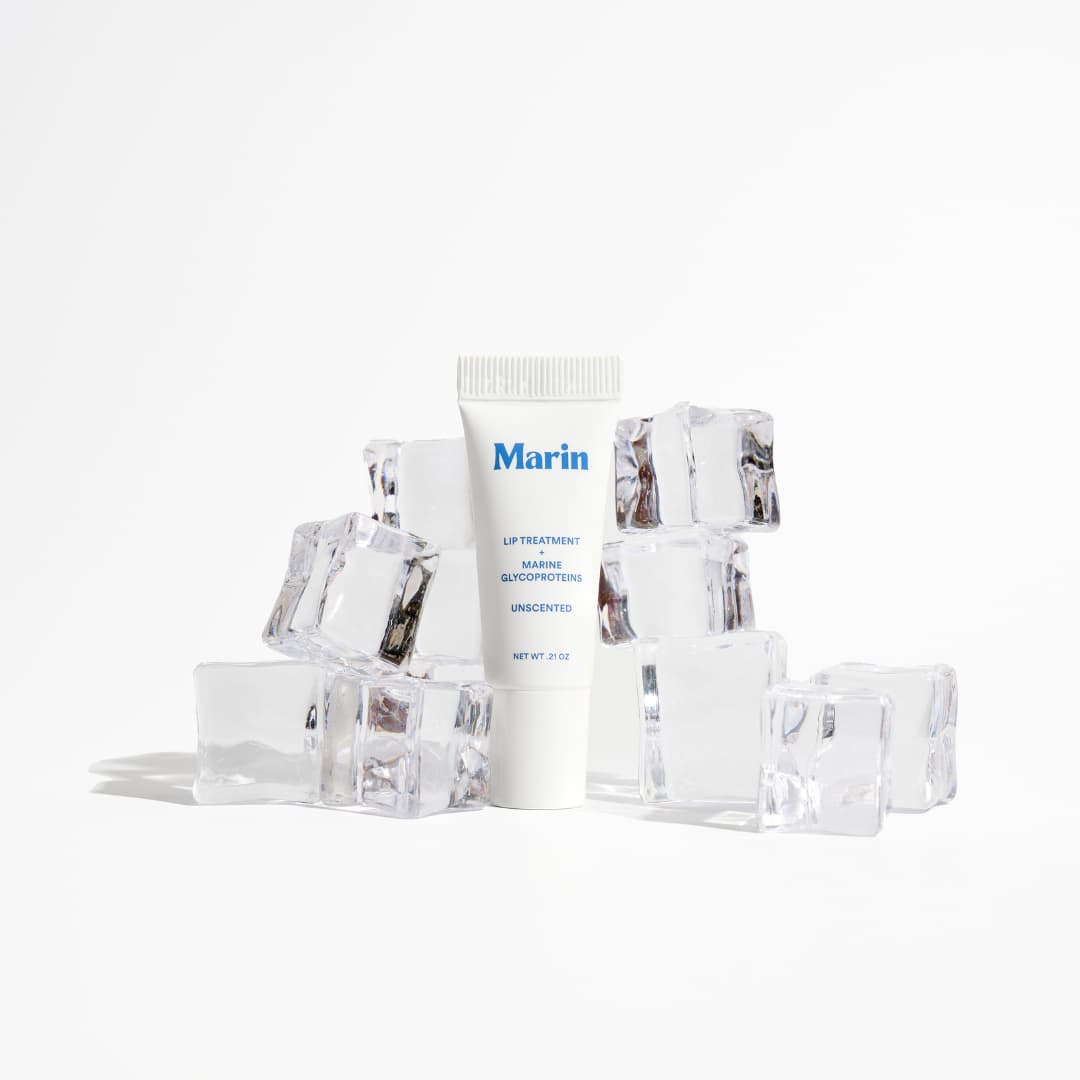 White Unscented tube with blue lettering surrounded by clear ice cubes
