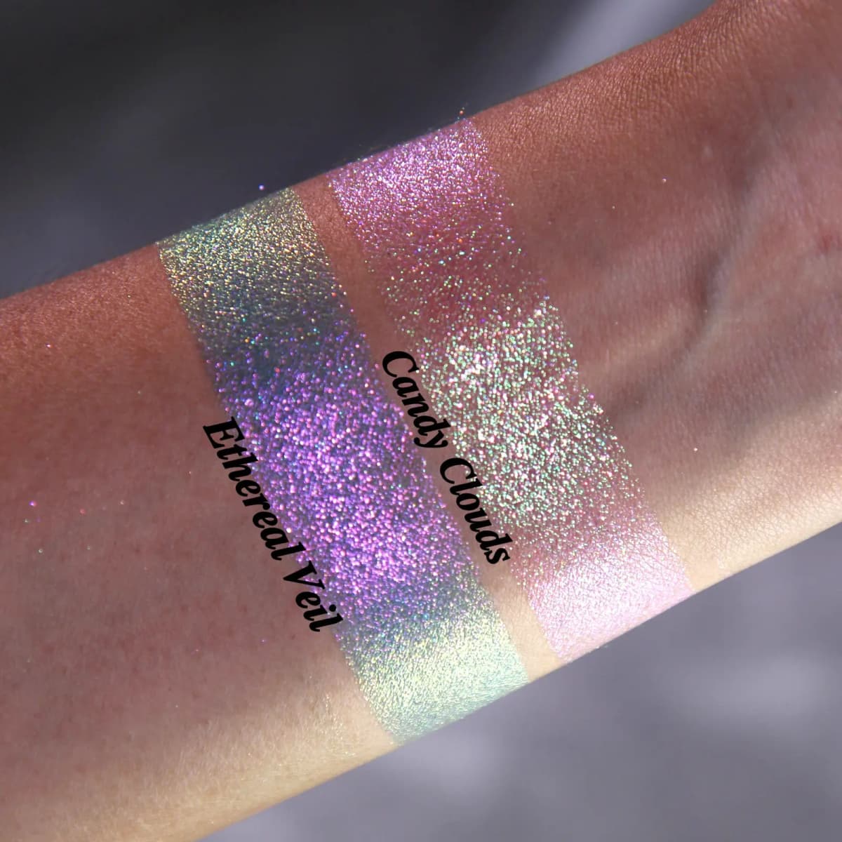 Close-up swatches on tan skin showing Ethereal Veil's green-purple shift and Candy Clouds' pink-gold duochrome