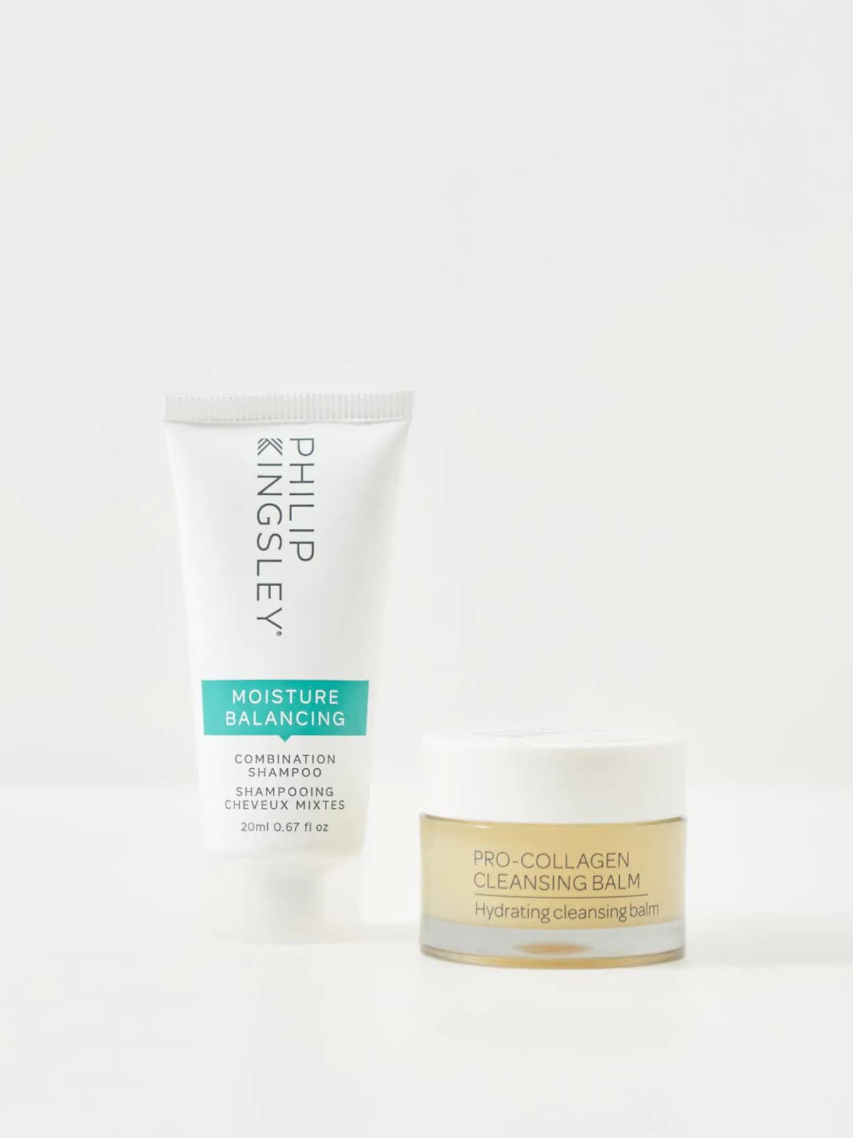 Philip Kingsley Moisture Balancing combination shampoo tube beside a Pro-Collagen Cleansing Balm jar