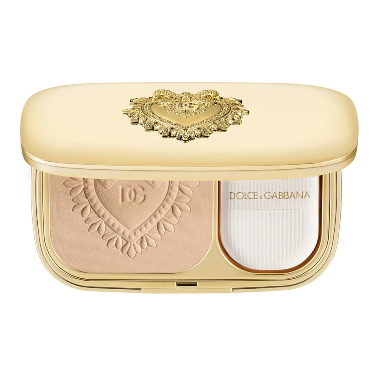 Open gold compact with light beige pressed powder embossed with a heart and a white Dolce&Gabbana sponge