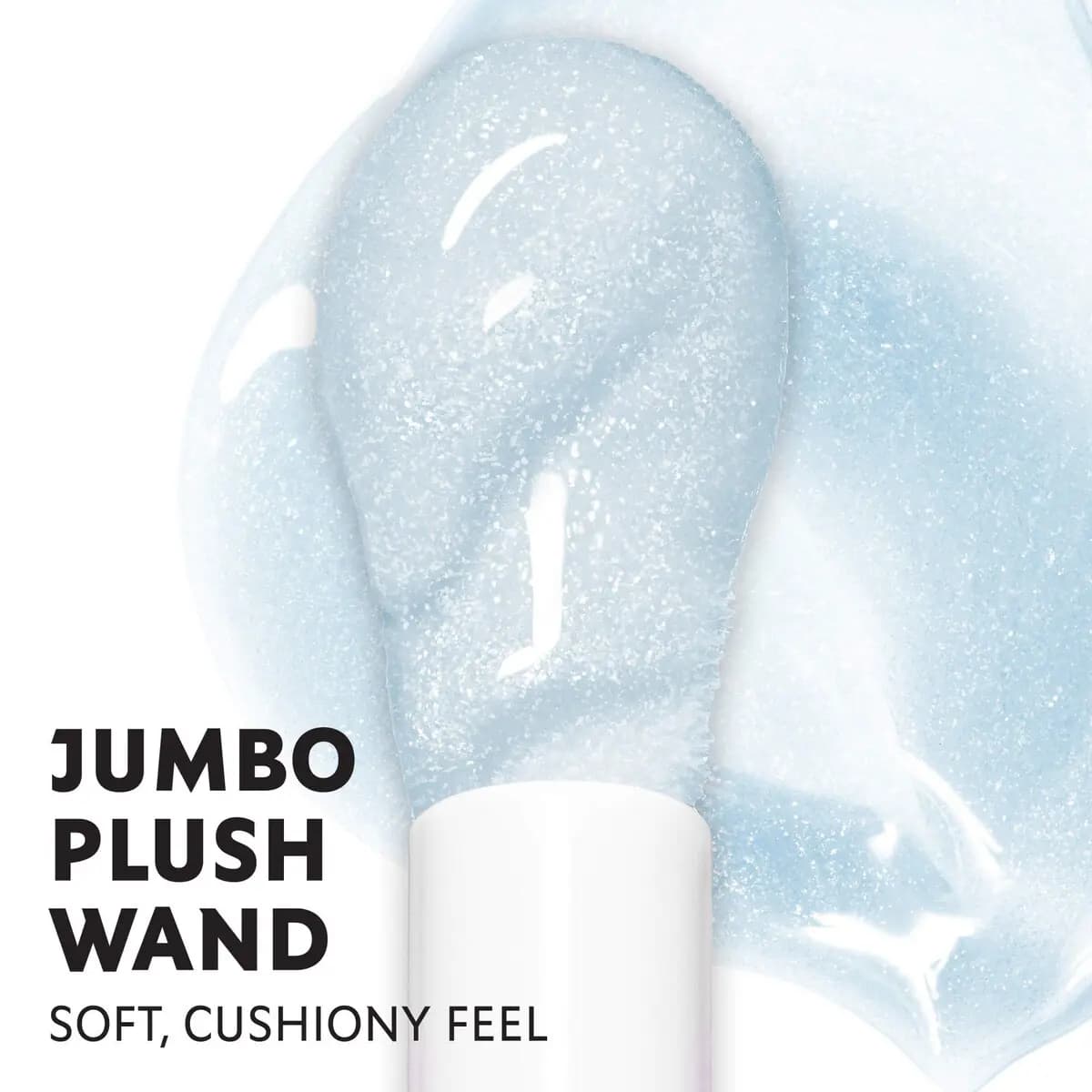 Close-up of a plush wand coated in pale blue shimmer gloss, text reads Jumbo Plush Wand, soft cushiony feel