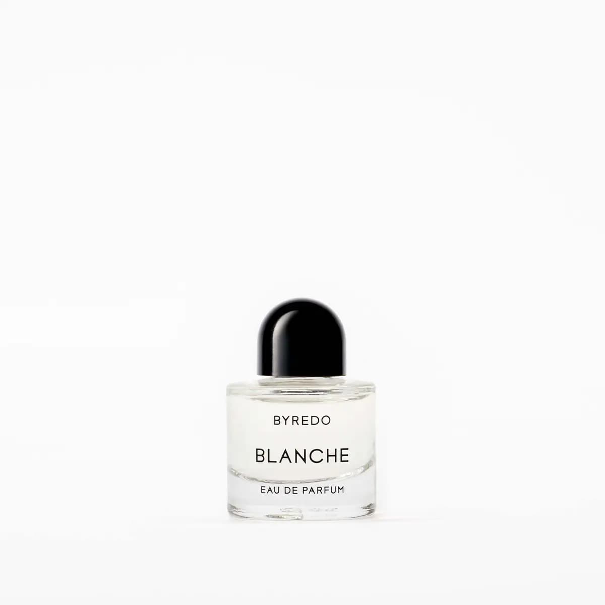 Blanche Eau de Parfum mini in clear glass with a rounded black cap