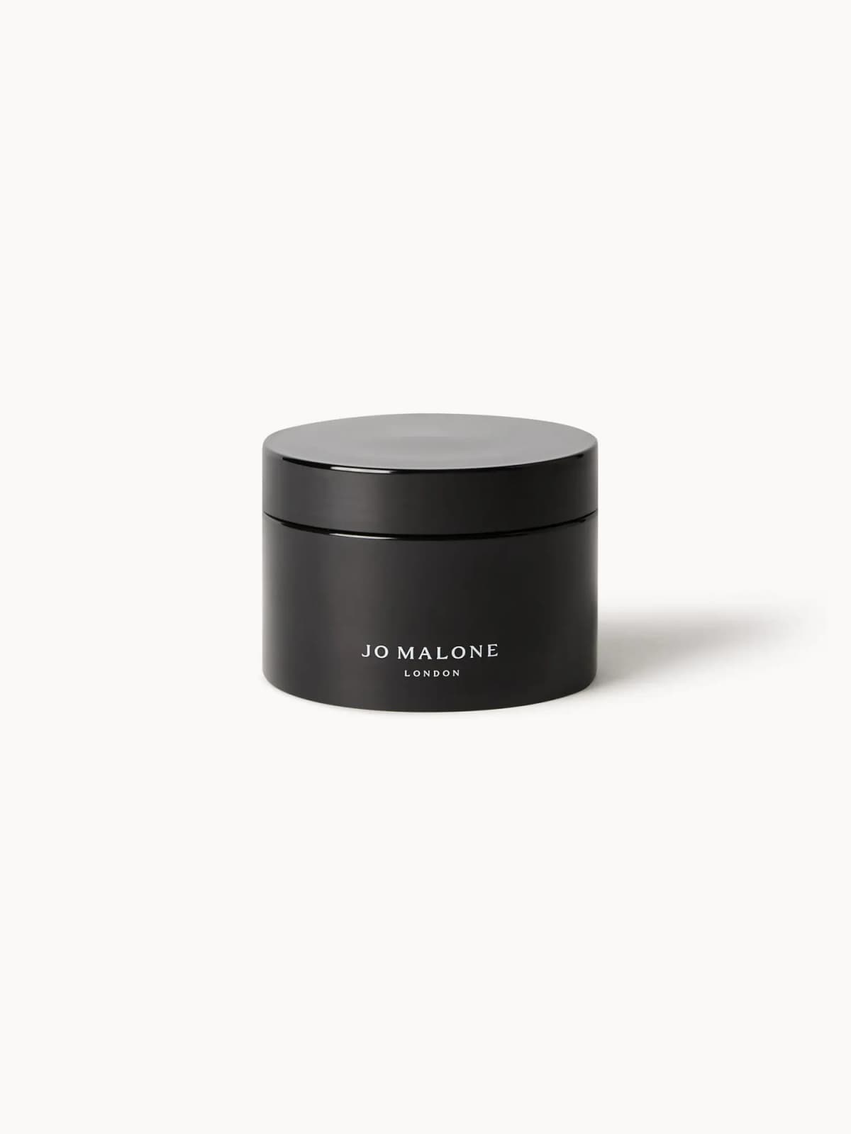Glossy black Jo Malone London jar with a screw lid