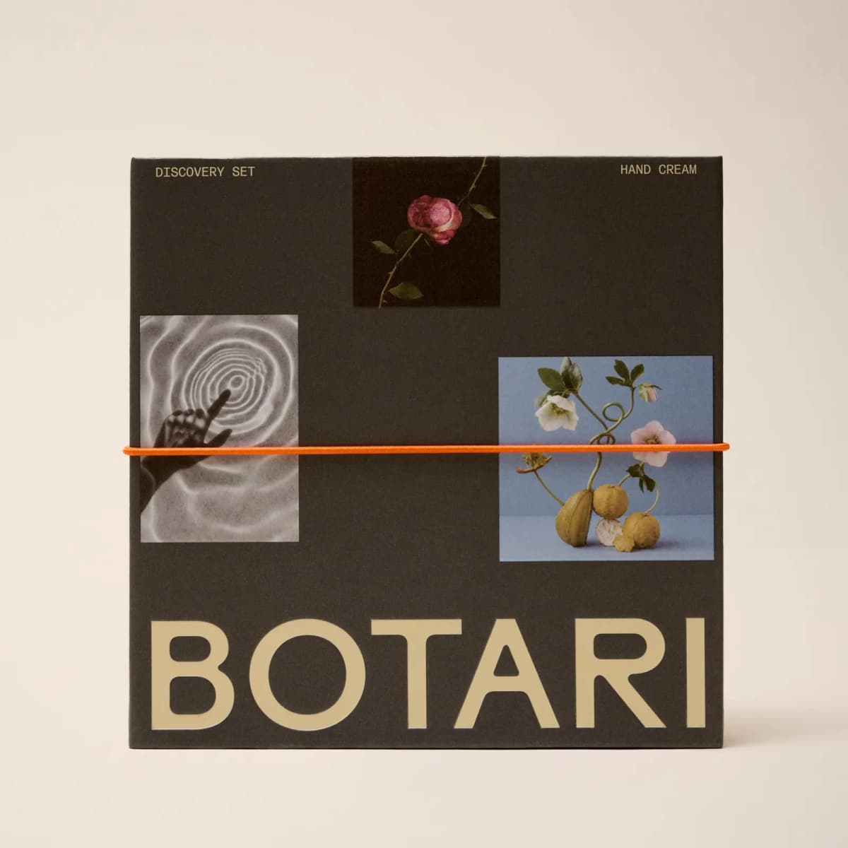 Dark BOTARI Hand Cream Discovery Set box with rose, water-ripple and citrus photos, tied with an orange elastic band