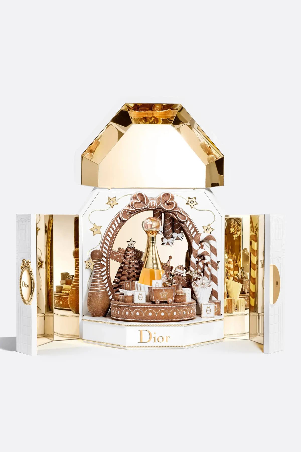 Opened white and gold music box with mirrored lid and side doors around a gingerbread carousel, shown on white backdrop