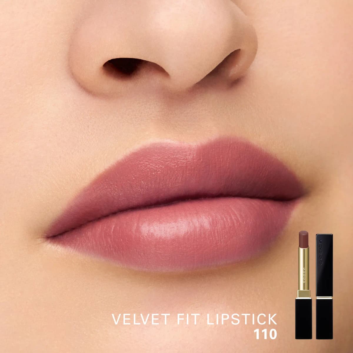 Lips wearing Velvet Fit Lipstick 110, a deeper rosy-brown with a soft satin finish