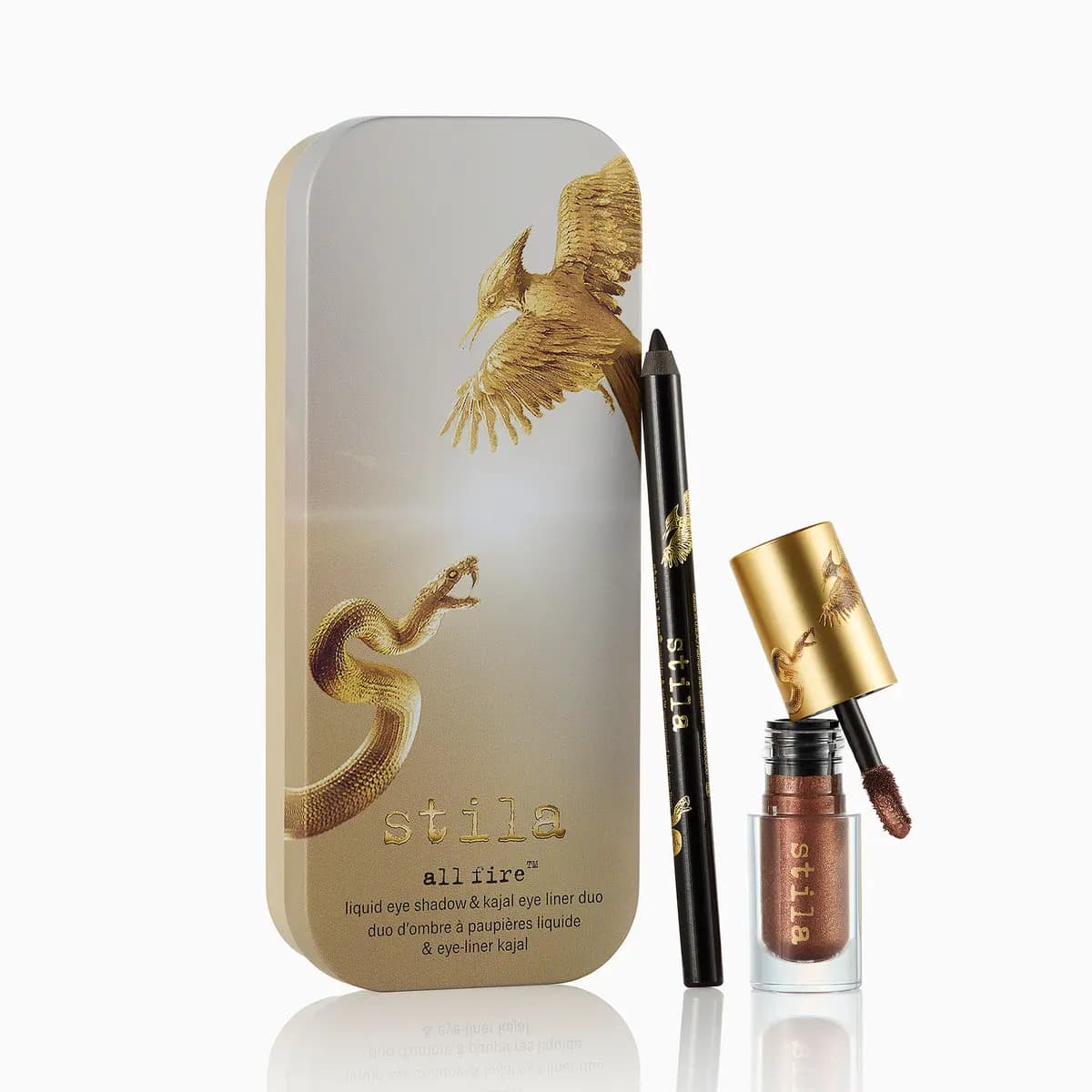 All Fire liquid eye shadow & kajal eye liner duo: shimmering bronze shadow and black pencil beside a gold bird-and-snake tin