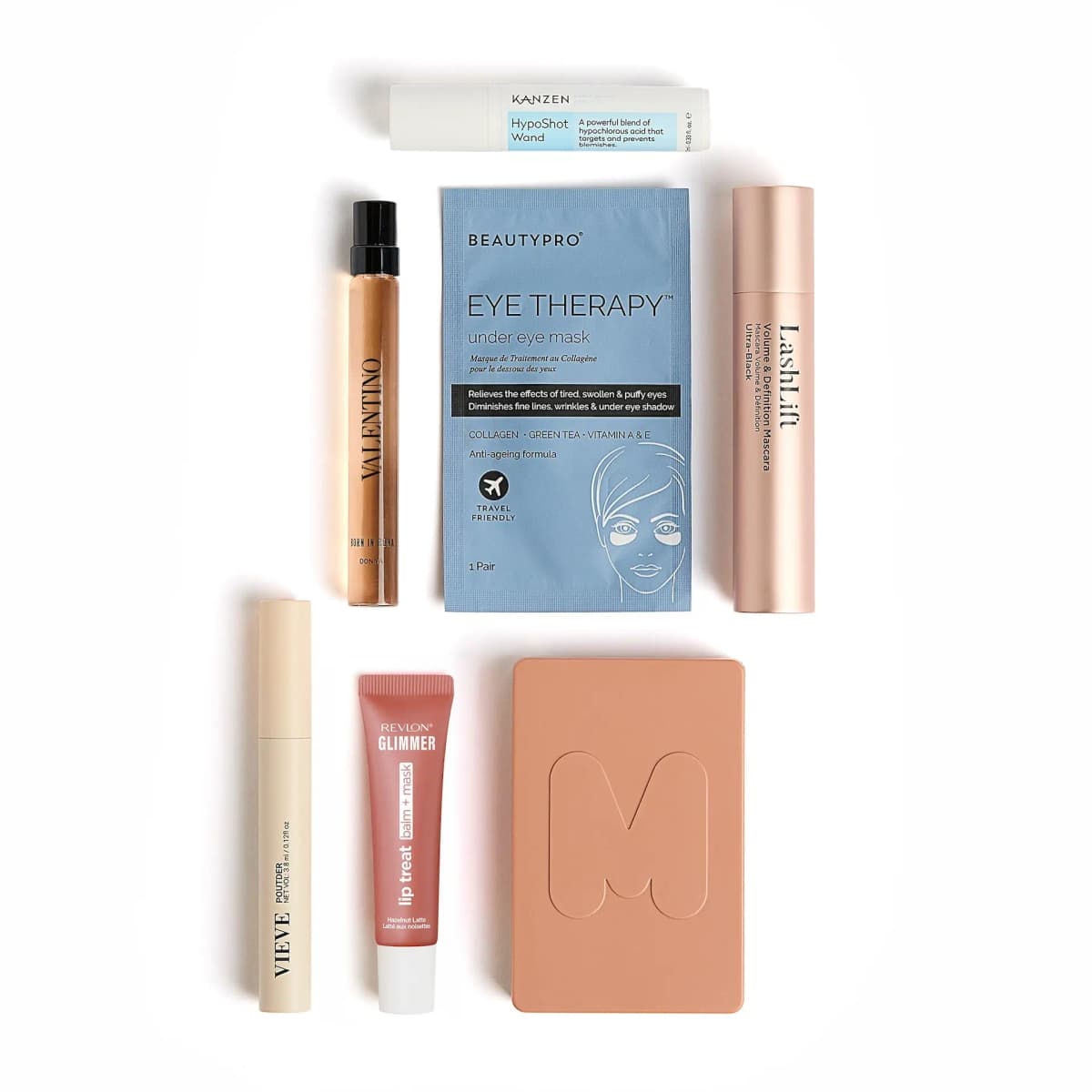 Flat lay of cracker items: Kanzen HypoShot Wand, Valentino, BeautyPro mask, LashLift, Vieve, Revlon and Morphe compact