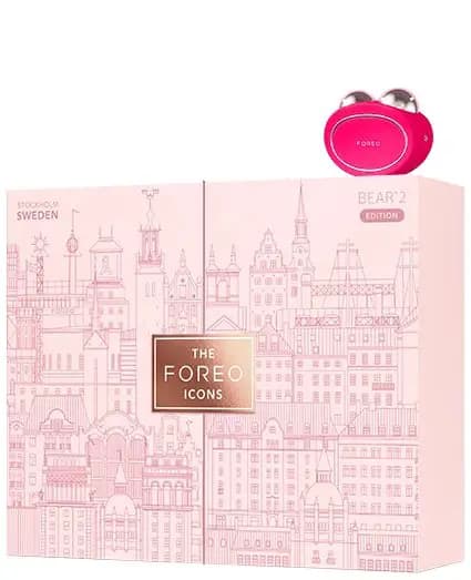 Closed pink BEAR 2 Edition box with Stockholm cityscape illustration and rose-gold logo beside a pink BEAR 2 device