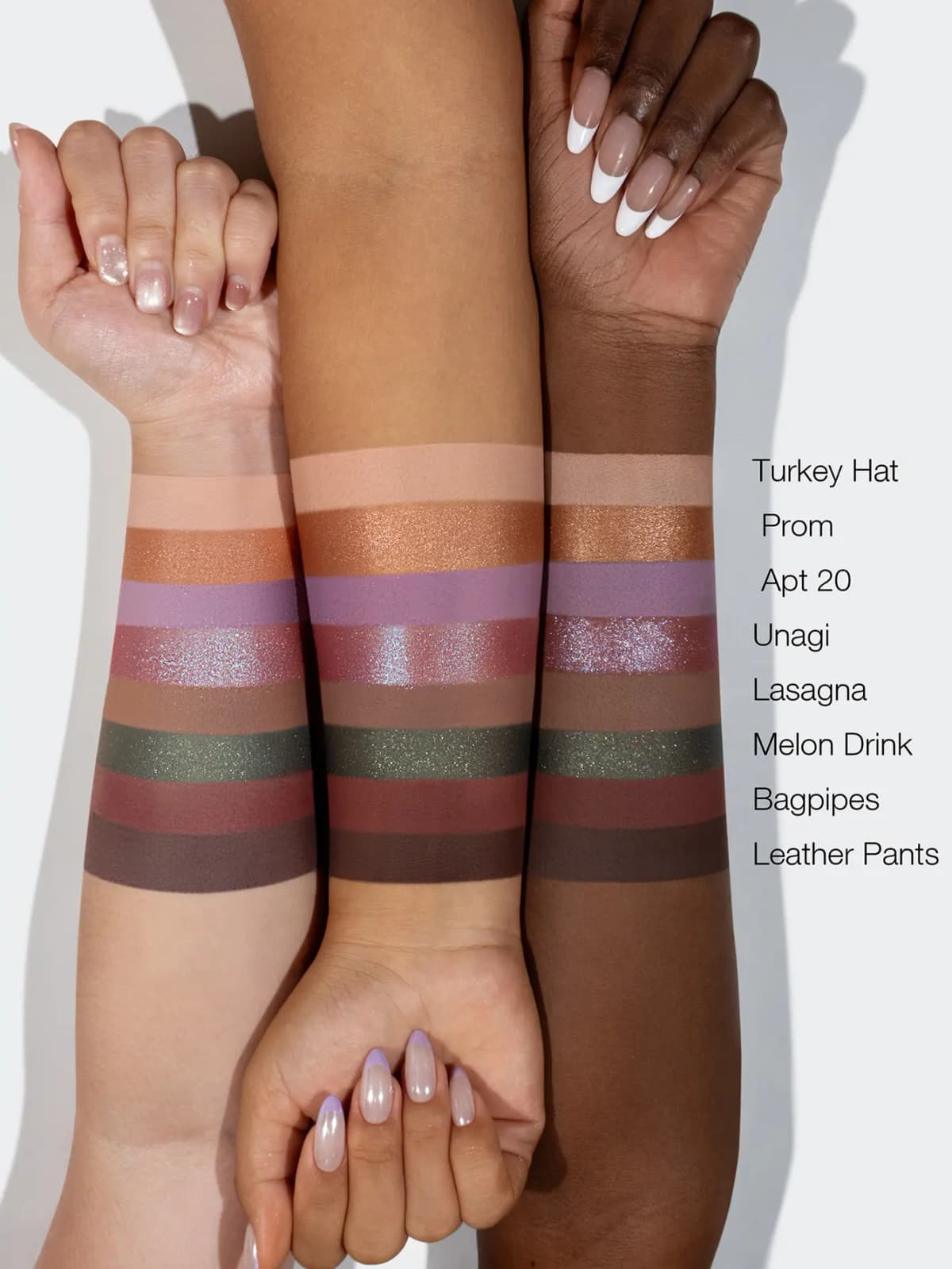Purple Door palette swatches on light, medium and deep arms, from peach Turkey Hat to brown Leather Pants