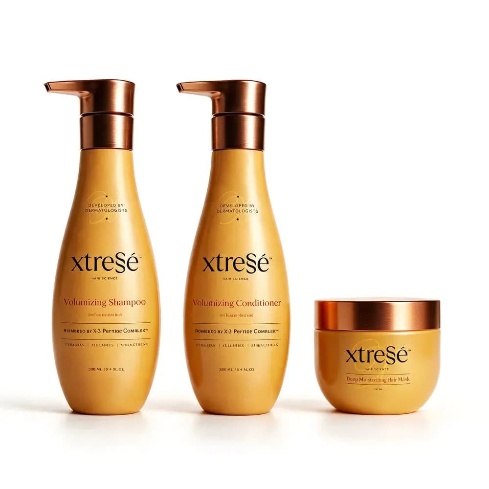 Volumizing Shampoo and Conditioner pump bottles beside a Deep Moisturizing Hair Mask jar on white