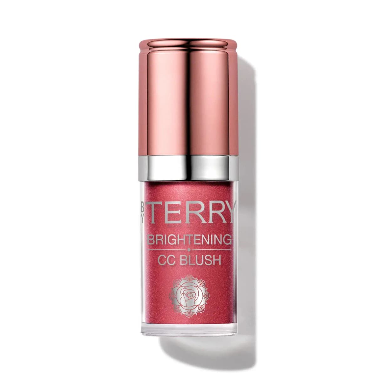 By Terry Brightening CC Blush in a deep shimmering raspberry red, rose-gold cap and silver band, on white.