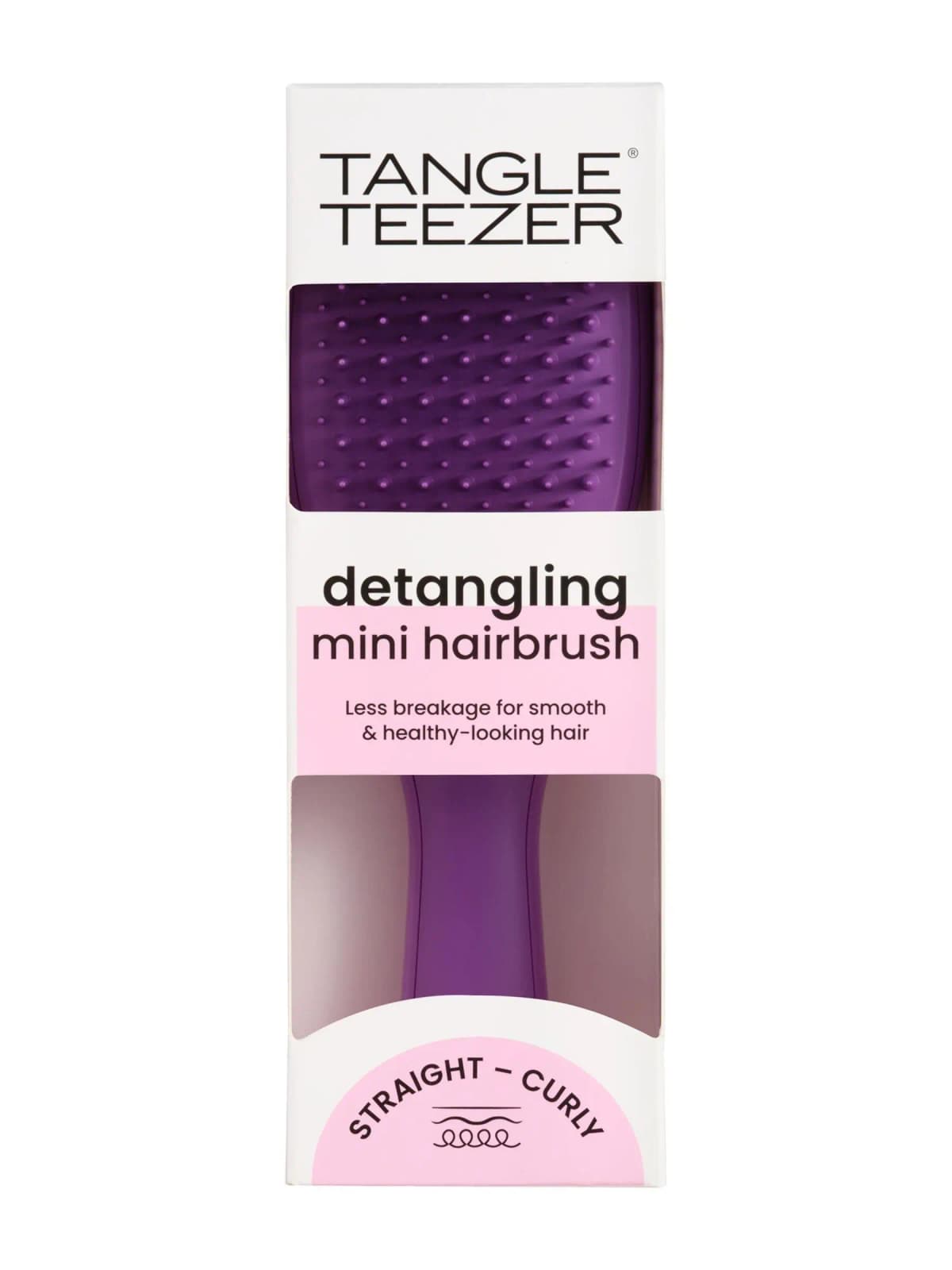 Tangle Teezer detangling mini hairbrush in purple, boxed in white and pink packaging marked straight to curly
