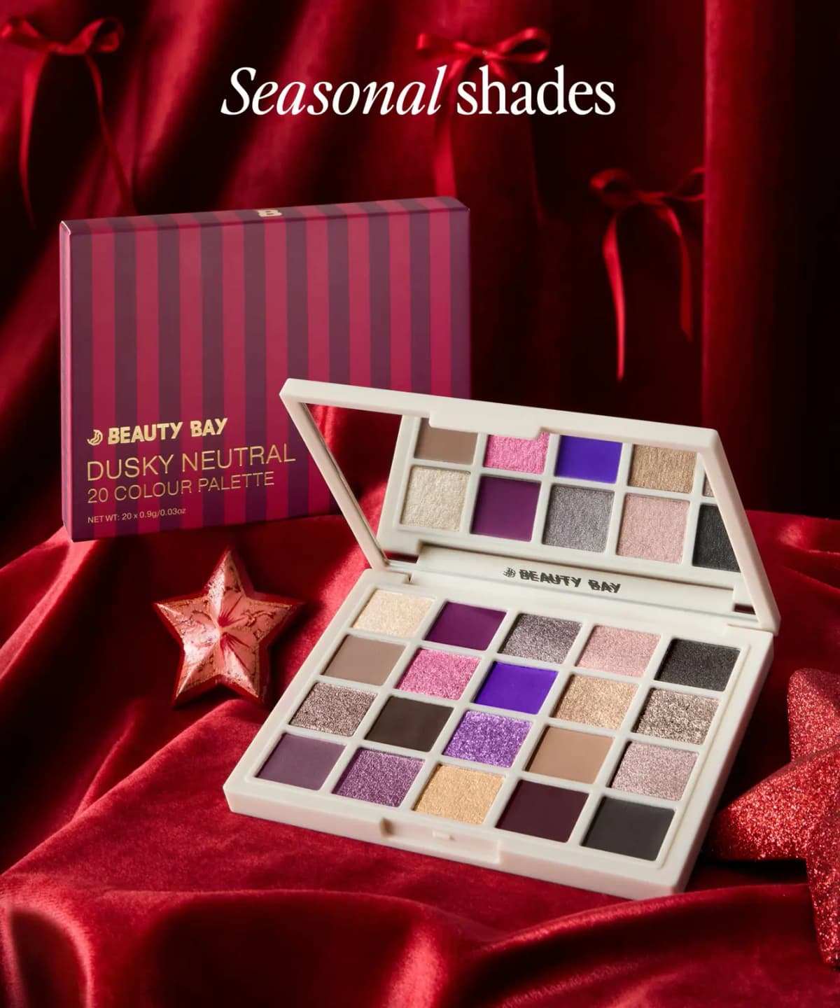 Dusky Neutral 20 Colour Palette open on red velvet beside its striped box and a star ornament, titled 'Seasonal shades