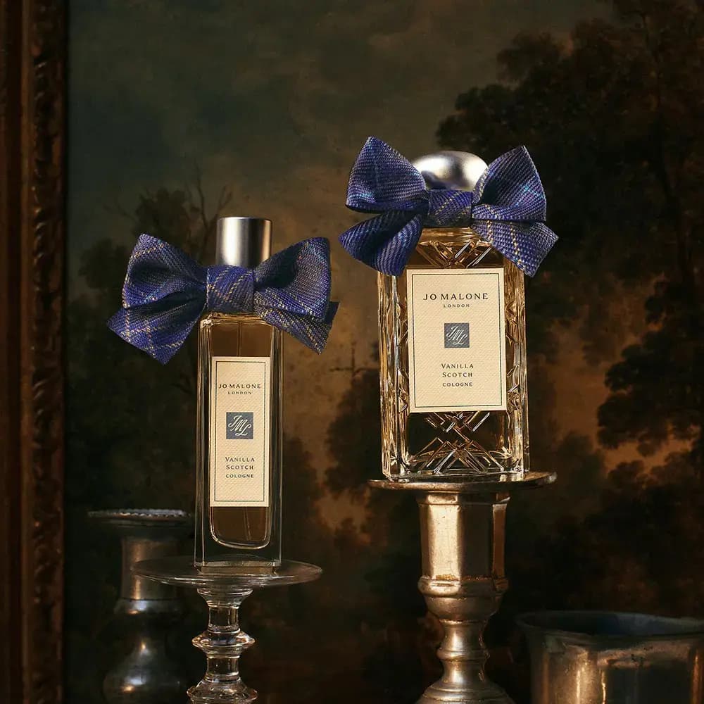 Vanilla Scotch Cologne in 30 ml and 100 ml bottles, with tartan bows on silver and glass stands