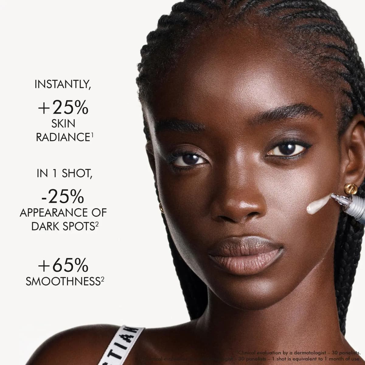 Model with braided hair and a serum swipe on her cheek beside stats: +25% radiance, -25% dark spots, +65% smoothness