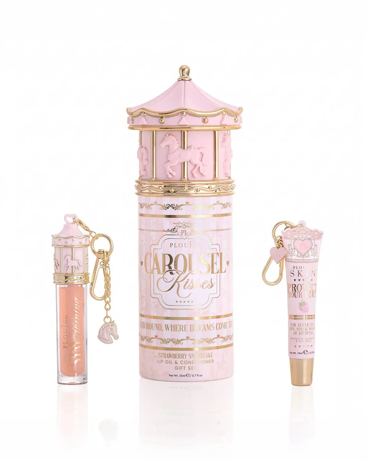 Carousel Kisses Strawberry Snowflake lip oil and conditioner gift set in a pink carousel tube with charm keyrings