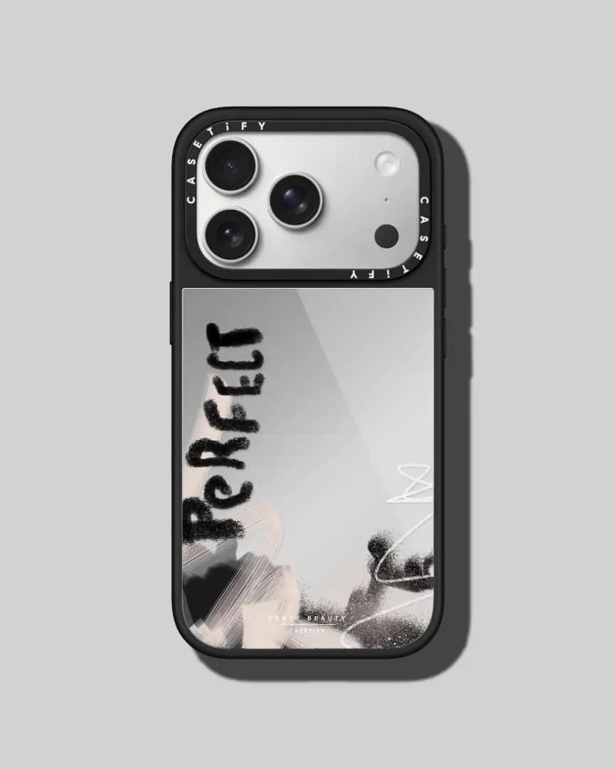 Black-framed iPhone case with mirror back, smudged black "Perfect" script and blush brushstrokes