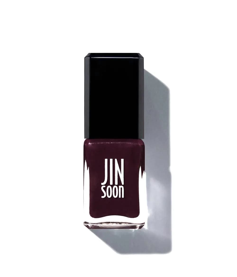 JINsoon nail polish bottle in a deep plum shade with a black cap on a white background