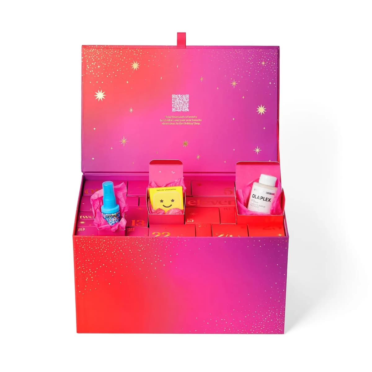 Open calendar box with numbered doors, three opened to show amika spray, a smiley pimple patch case and Olaplex No.3