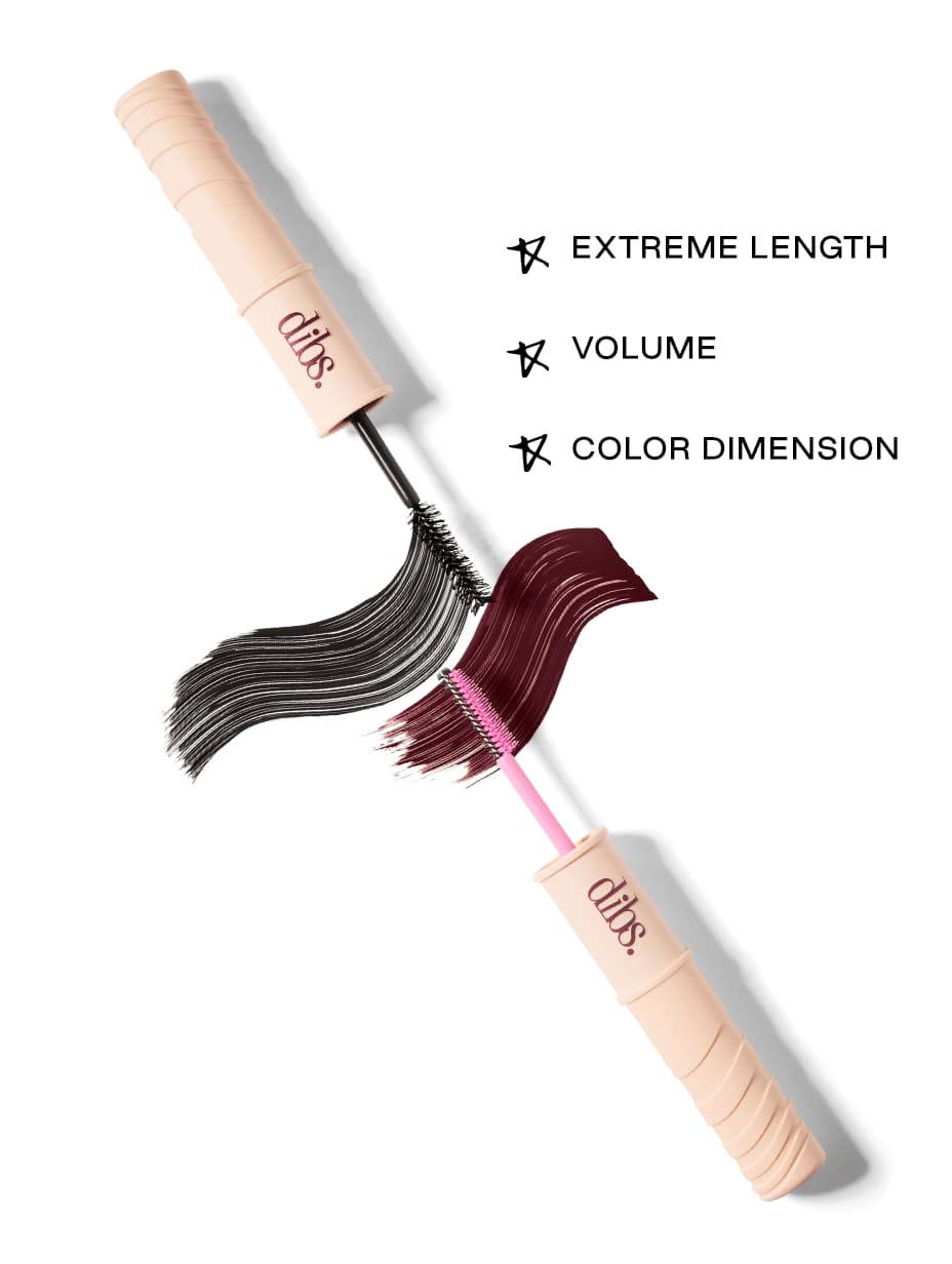 Open tube laid diagonally with black and burgundy swatches, listing extreme length, volume and colour dimension