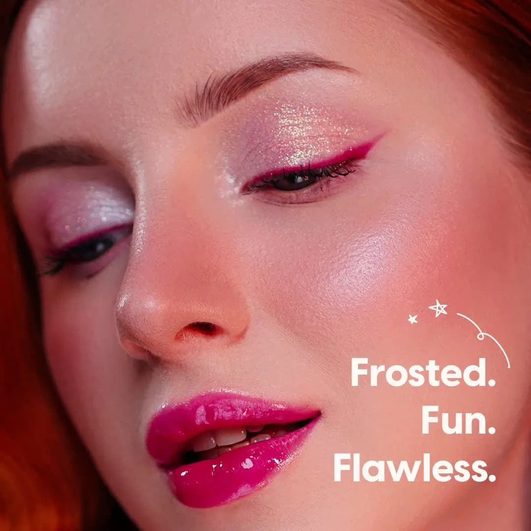 Model with sparkly lilac eyeshadow, magenta liner and glossy fuchsia lips beside "Frosted. Fun. Flawless." text