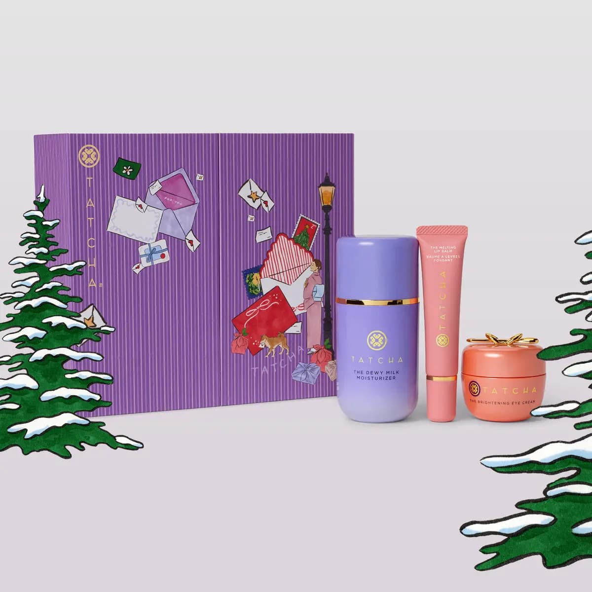 Purple illustrated Tatcha box with The Dewy Milk Moisturizer, The Melting Lip Balm and The Brightening Eye Cream
