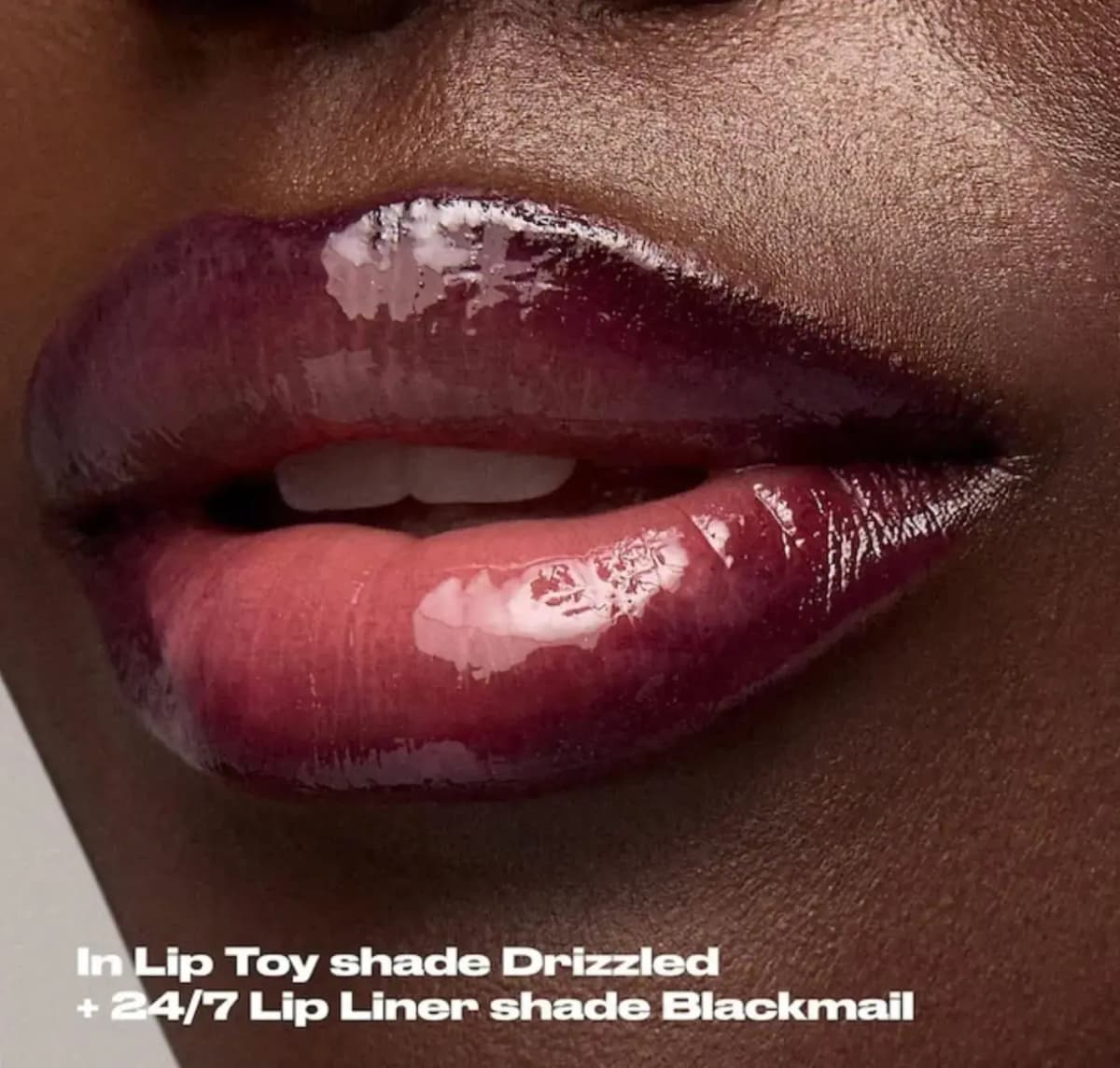 Close-up of deep-toned lips in glossy plum Lip Toy shade Drizzled lined with 24/7 Lip Liner shade Blackmail